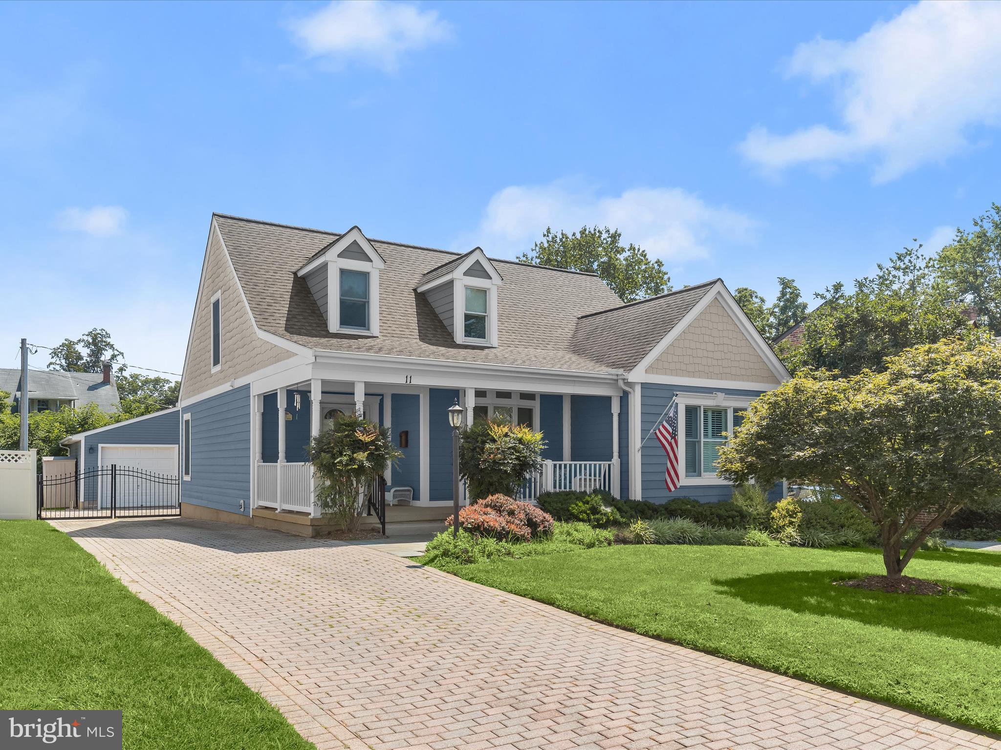 Welcome to 11 Locust Drive, a beautifully updated Cape Cod nestled in the heart of Catonsville. This charming home is full of character and modern comfort, beginning with its striking Hardie Plank exterior, inviting covered front porch, and an oversized two car detached garage with workshop space. The fenced backyard offers a covered patio with a ceiling fan ideal for hosting classic Catonsville gatherings.
Inside, hardwood floors, stately columns, wainscoting, and classic moldings grace the main level living and dining rooms. The living room centers around a cozy fireplace, while the dining room features a bay window. The kitchen is designed for both style and function, offering stainless steel appliances, Corian counters, display cabinetry, decorative backsplash, pantry, breakfast bar, and a casual dining area with access to the rear patio. The main-level primary suite includes new carpet, a walk-in closet, recently remodeled full bath and plantation shutters. A convenient powder room and laundry area complete this level. Upstairs, you'll find two generously sized bedrooms and a full bath, while the finished lower level includes a large recreation room with wet bar, fireplace, a half bath (with a rough in for a full) and an additional bedroom/office. Additional highlights include Andersen windows, 2019 water heater, 2016 HVAC, 2013 new roof, siding & gutters. A short walk to the library, restaurants, farmers market, shops and more! Walk-ability to all things Catonsville is a 10+!
Some photos are Virtually Staged