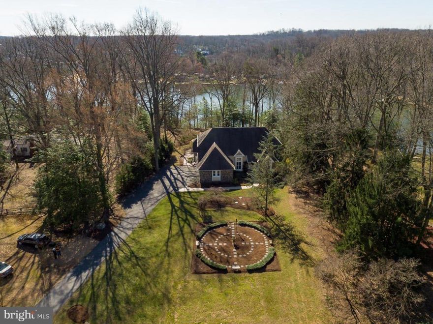 Beautiful Water Front Estate nestled on 2 1/2 acres located on Plum Creek!  Explore the Severn River or relax at home with gorgeous gardens, ponds, extensive decks, hot tub and much more!  Main level master bedroom, heated tile floors, gorgeous gourmet kitchen, two fireplaces, huge finished basement, three car garage, workshop, greenhouse, pier and boatlift.  Custom home is great for entertaining.