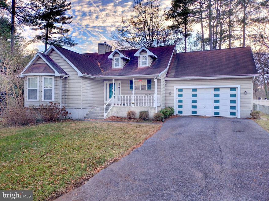 Welcome home!  This lovely 4 bedroom, 2.5 bath Rancher in Elkridge, Howard County is loaded with new features and updates!  Newly installed  luxury vinyl plank flooring.  Large, light-filled kitchen with handsome stainless steel appliances.  The entire main level is freshly painted. You'll love the 2 unique, contemporary skylights that absolutely light up the beautiful new flooring!  The living room features an impressive cathedral ceiling over a gas fireplace and French door access to back yard bliss on your low-maintenance composite deck.  Large windows with new cordless blinds provide ample natural light throughout the main level.  Primary bedroom suite with attached bathroom, 2 additional spacious bedrooms, and another full bath.  Downstairs a large, finished recreation room awaits you, along with an additional bedroom and half bath.  The lower level also includes a rough-in for a wet bar, and windows that provide additional natural light.  This home has an unmistakable feeling of privacy with a back yard backing to a private lane on a naturesque lot, yet provides the ultimate convenience of close proximity to I-95, MD-32, and US-29.  Come see for yourself before it's gone!