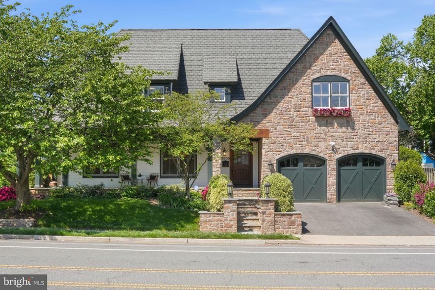 2808 John Marshall Drive presents a timeless European cottage-inspired façade—stone-clad, warmly scaled, and defined by steeply pitched gables, arched openings, and carriage-style garage doors. A broad front porch, framed by stone walls and manicured plantings, creates an immediate sense of arrival and approachability, while the handsome stain grade arched front door sets the tone for what’s to come. Built by Phoenix Builders, one of Arlington's premier builders of the time, and designed by acclaimed architect Thomas French, the home reflects an enduring commitment to quality, craftsmanship, and thoughtful design. Recently renovated with new baths, an updated kitchen, new light fixtures, fresh paint and new carpet (and a great yard) this house is not to be missed! 
Inside, the home unfolds with a layout that is both classic and highly livable. The foyer introduces a series of well-proportioned spaces, where the formal living room and dining room connect naturally for everyday use and entertaining. A private study, tucked to the side with its own exterior access to the front porch, offers flexibility for work or quiet retreat.
Toward the rear, the home opens into a generous and renovated kitchen and family room—an inviting, light-filled space anchored by a central island and designed for gathering. The kitchen is supported by pantry storage and flows seamlessly to the outdoor living area, extending the home’s functionality beyond its interior walls. A mudroom provides a practical transition to the attached two-car garage.
Upstairs, the bedroom level is thoughtfully arranged for both privacy and comfort. The primary suite is set apart, featuring a large bedroom, a separate sitting room (an additional closet or nursery perhaps?) which offers hidden storage, a large walk-in closet, and a spacious renovated bath. Three additional bedrooms are well-sized and served by two brand new bathrooms, while a centrally located & huge laundry room with two sets of w/d enhances everyday convenience.
The lower level is designed for recreation and flexibility, offering a large open recreation room complemented by a dedicated billiards area and a wet bar. A fifth bedroom with an adjacent bath provides ideal guest or au pair accommodations, while direct exterior access adds versatility. An expansive unfinished area offers excellent storage or future potential.
The rear yard is designed as an extension of the home, with a covered patio, structured hardscape, and curated landscaping that support both entertaining and quiet outdoor living.
Throughout, the home reflects a balance of enduring architectural character and thoughtful updates, offering a cohesive living experience across all three levels in one of Arlington’s most desirable locations.