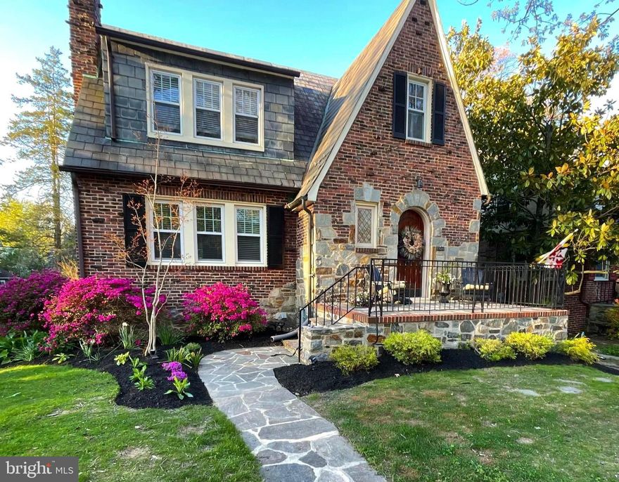 Charming and beautifully updated Tudor home on a quiet, tree-lined street. Classic brick exterior with stone trim and slate roof offers timeless curb appeal. Inside, refinished hardwood floors, elegant moldings, and detailed millwork create a warm and inviting atmosphere.
The welcoming foyer features an updated powder room and an archway leading to the spacious living room with fireplace. A formal dining room with wainscoting is perfect for entertaining. The updated kitchen boasts granite countertops, stainless steel appliances, and a bright breakfast area.
Upstairs, the second level includes a primary bedroom, two additional generously sized bedrooms, and a beautifully updated full bath.
The amazing walk-out lower level offers exceptional living space, including a family room with wet bar, private office, and updated full bath — ideal for guests, work-from-home, or recreation.
Enjoy the flat, fenced backyard with a brick patio, fire pit, and large garden shed — perfect for relaxing or entertaining.
Located in the desirable Anneslie neighborhood in Towson,  this home blends classic Tudor charm with modern updates.