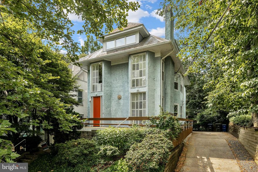 Incredible opportunity on PRIME Cleveland Park block across from Rosedale! 1912 American foursquare set on SPECTACULAR 9,500 + SF flat lot! 1960s Hugh Newell Jacobsen renovation features 9'+ ceilings and generously-proportioned, sunlit rooms with dramatic large windows and walls of glass overlooking Rosedale Conservancy and south-facing DEEP and private back garden. Foyer with two closets and powder room, dining room with fireplace, kitchen with access to wrap-around porch/driveway, and grand living room with 12' ceilings and level walkout to back patio on main level. 5-6 Bedrooms, 3 full baths, and laundry room upstairs. Spacious lower level could be finished into additional living space. Easy parking in private driveway!
