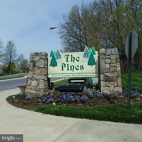 Lovely terrace level one bedroom plus den condo with a large patio. Freshly painted, brand new flooring throughout. Den can be used as a dining room/second bedroom or home office. Age 55+ gated community. Amenities include golf, tennis, pools, medical facilities & local transportation. Make this your new home.