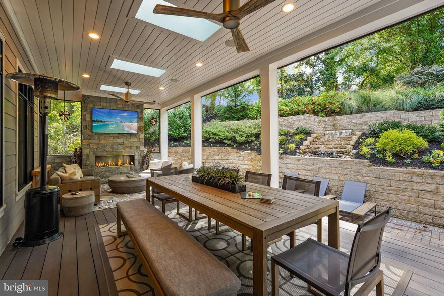 Welcome to 3400 Military Road! This stunning 5-bedroom, 6-bathroom home offers exceptional comfort, space, and modern amenities in a beautifully maintained setting. Situated on a professionally landscaped lot, this residence features a thoughtfully designed layout perfect for both entertaining and everyday living.

The main level boasts an open floor plan, high ceilings, and upscale finishes throughout. A chef's kitchen with premium appliances opens seamlessly to spacious living and dining areas. Retreat to the expansive owner's suite, complete with a luxurious en-suite bathroom and ample closet space. Step outside to the screened-in porch, ideal for year-round outdoor enjoyment. The backyard has been elevated with custom hardscaping and refreshed landscaping, providing a serene and private outdoor space that’s perfect for hosting or relaxing.

Additional highlights include an elevator for comfort and convenience, generous secondary ensuite bedrooms, a fully finished lower level with tall ceilings, a full wet bar, and ample storage throughout. Every inch of this home has been curated with meticulous attention to detail to provide a luxurious living experience.

This spectacular homes truly shines, inside and out! Located in the Broyhill Forest neighborhood of North Arlington, you are surrounded by 2 parks (Broyhill Forest Park and Potomac Overlook Regional Park) and are nearby to the Potomac River, 15 minutes to DC, and just a bit further to the Pentagon, Tysons, National Landing, and Bethesda for the best of upscale dining, shopping and cultural entertainment.

Don’t miss your chance to own this exceptional home — where style meets functionality in an enviable location. 3400 Military Road is not just a home, it's a lifestyle. Welcome Home!