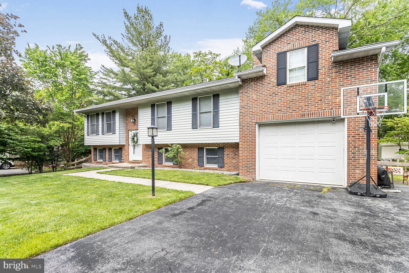 Welcome to 209 Oella Ave - a spacious and updated split foyer in the heart of Oella, offering 5 bedrooms and 3 full baths. This home offers approximately 1,850 square feet of finished above-grade space, including a beautifully converted primary suite above the garage. This private upper-level retreat provides ample space and includes an area perfect for a future fourth full bath. Fresh paint and new carpet throughout create a clean and inviting feel. The lower level features a cozy fireplace, a full bath, and a fifth bedroom—ideal for guests, a home office, or additional living space. Enjoy a large backyard, an attached garage, and a prime location that’s hard to beat: just minutes to downtown Ellicott City, downtown Catonsville, the Trolley Trail, and directly across the street from Benjamin Banneker Park. Commuters will love the easy access to all major routes while still enjoying the charm and serenity of the Oella community. A rare opportunity in an ideal location! Schedule your tour today! OPEN HOUSE: Sunday 5/18 12:00-3:00pm!