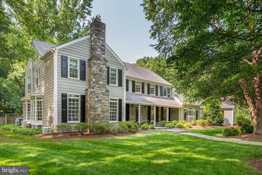 Offered for the First Time – Grand Custom Colonial on 2.8 Private Acres – Rare Gem in Potomac! Tucked away on a quiet cul-de-sac just minutes from Potomac Village, this extraordinary Colonial estate offers the best of both worlds: luxurious privacy and seamless access everywhere you need to go. Thoughtfully designed and masterfully expanded with two custom renovations by Brendan O’Neill, this one-of-a-kind home is ideal for both large-scale entertaining and comfortable everyday living. Inside, the home exudes timeless elegance and exceptional scale, offering over 7,500 square feet, 7 bedrooms, 6 full baths, and 2 half baths. The gracious foyer opens to formal living and dining rooms, while the dramatic great room impresses with vaulted ceilings, skylights, a stone wall fireplace, wet bar, and a wall of sliding glass doors overlooking the backyard oasis. The chef’s kitchen is as beautiful as it is functional, with a vaulted wood-paneled ceiling, custom cabinetry, brick walls, a cooking station, oversized island, eat-in table space, built-in hutch, and a sunlit bay window breakfast nook. The main level also includes a private guest suite, a dedicated office with custom built-ins, and a generous laundry/mudroom with a powder room—ideal for modern family living. Upstairs, the serene primary suite features a vaulted ceiling, spacious walk-in closet, hall closets and linen closet, dressing area with vanity, and a luxurious spa bath complete with a soaking tub, walk-in shower, dual vanities, and private water closet. The fully finished lower-level expands the living space with new luxury vinyl flooring (2025), a full wet bar, family room, recreation area, 7th bedroom, full bath, and extensive storage, including a cedar closet. Set on a flat, beautifully landscaped lot, the property features a stunning swimming pool, meditation garden, sport court, expansive hardscaping and patio, and a spacious rear deck—a picture-perfect backdrop for gatherings or peaceful mornings. Additional highlights include a charming front porch, circular driveway, and 3-car side-loading garage, replaced slate roof and windows (2015)—all set in one of Potomac’s most coveted locations. This is a rare opportunity to own a grand yet welcoming home where privacy, beauty, and convenience come together in perfect harmony.