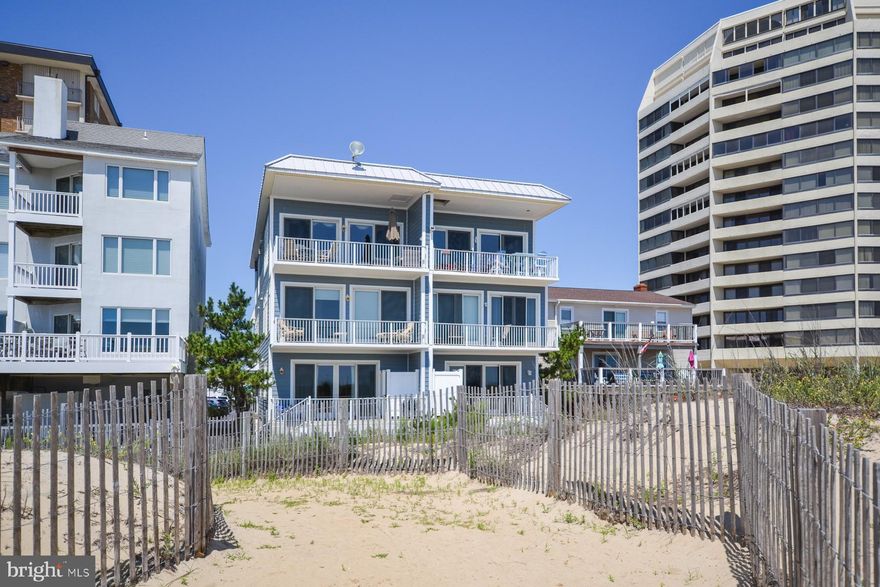 Welcome to 8407 Atlantic Ave, a remarkable beachfront property nestled on the pristine shores of Ocean City, Maryland. Situated directly on the sand, this home is one half of a duplex and promises an extraordinary coastal living experience. As you step inside, prepare to be enchanted by over 3,223 square feet of luxurious living space. The open-concept design seamlessly blends modern elegance with beachside comfort, creating an inviting atmosphere that is perfect for both relaxation and entertaining. The main focal point of the home is the expansive chef's kitchen, featuring a Thermador gas range, perfect for creating culinary delights. With two islands providing ample counter space, custom cabinetry, and top-of-the-line appliances, this kitchen is a dream come true for any culinary enthusiast. The attention to detail is evident throughout the home, with the rich hardwood floors adding a touch of sophistication to the living spaces. The 9-foot ceilings create an open and airy ambiance, accentuating the sense of space and allowing natural light to flood in, enhancing the coastal atmosphere. For added convenience, an elevator awaits, ensuring easy access to all levels of the home. Whether it's carrying groceries, transporting luggage, or simply providing ease of movement, the elevator is a valuable feature that adds an extra layer of comfort to daily living. Safety and durability are paramount, especially in a beachfront property. Anderson Impact Windows have been thoughtfully installed throughout, providing protection against the elements while still allowing for breathtaking ocean views. These windows not only provide peace of mind but also offer energy efficiency and noise reduction, enhancing the overall comfort of the home. Beyond the impressive interiors and upgrades, step outside and revel in the outdoor paradise this property offers. From any of the 3 private decks, soak in panoramic ocean views, breathe in the salty air, and experience the ultimate coastal lifestyle. Whether it's basking in the sun, hosting gatherings with loved ones, or simply relishing the beauty of your surroundings, this beachfront oasis is designed to elevate your everyday living. Located on Atlantic Ave, this home is conveniently situated near some of the area's finest dining, shopping, and entertainment venues. Enjoy the renowned boardwalk, indulge in local seafood delicacies, or immerse yourself in the vibrant beach town atmosphere that Ocean City is famous for!