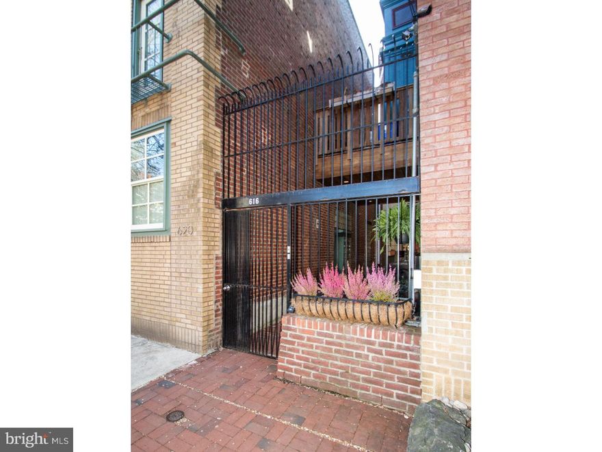Dramatic Candy Factory conversion in charming Queen Village overflowing with 4 bedrooms, 4 baths, astonishing features, Amish/chef's kitchen, two fireplaces, skylight, exposed bricks, beams and ductwork, 13ft ceilings, breathtaking roof deck with river and city views, elevator, 1-year prepaid 2-car garage parking and more. This NYC Tribeca/SoHo style property has been lovingly restored/converted by the renowned architect, Cecil Baker, into a Breathtaking and Magnificent 4095sf home located in a private, gated, tranquil setting. This unique abode includes a communal front courtyard entrance, huge open loft space, beautiful, gleaming hardwood floors throughout, and a master suite with a spa like bathroom that includes double sinks, a soaking tub and a separate stall shower. The first floor guest suite (located in the converted Silo) is rounded and boasts its own sumptuous bathroom and closets/storage areas. There is also a den/sitting room on this floor and an open gallery/foyer area. The second floor is an open plan with 13ft+ ceilings, a sweeping Great room with a focal fireplace and a serious custom chef's Amish handmade kitchen with tons of cabinets, work space, stone counter tops, double farm sink and a commercial grade range. The third floor contains two ultra-spacious master suites; one with an open loft area currently used an office, but could easily be used for an exercise room or nursery. All levels are connected by an elevator, even to the roof deck! The unbelievable rooftop deck offers a beautiful cedar deck with panoramic 360 degree City views. A walk score of 97, restaurants, galleries, and all of the arts makes this a prime location. Do not miss out, set your appointment today!! Most furniture, player piano and art work are negotiable. Truly a once in a lifetime opportunity.
