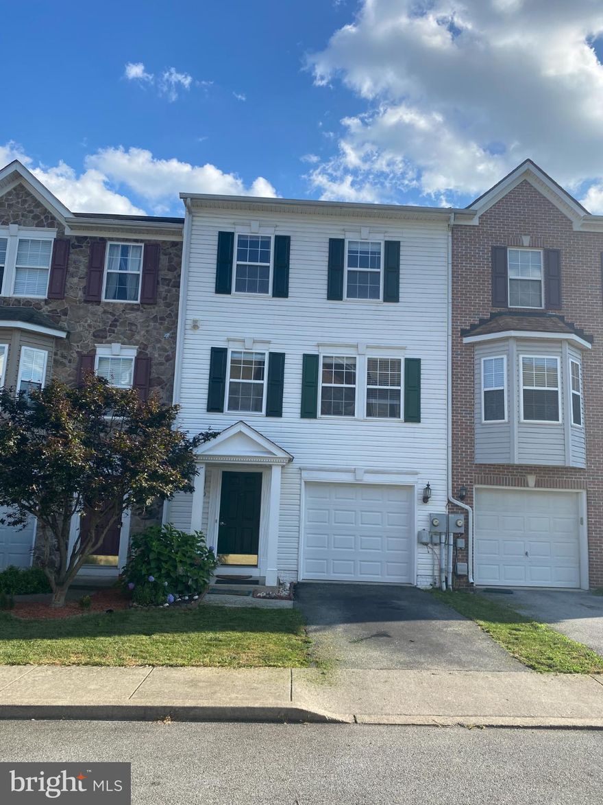 Spacious three-level town home for rent in County Green, Charles Town, WV. Main level includes built-in garage, laundry, office space, and family room that looks out on the fenced back yard. The stairs lead to the eat-in kitchen, dining area, living room, and second-floor deck. The third floor includes a large primary suite with walk-in closet, primary bath with garden tub and shower. Two secondary bedrooms and the hall bathroom complete top level.