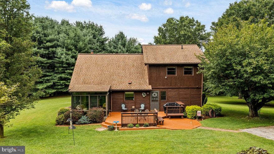 This gorgeous log home sits nestled on the 4+ acre corner of Falls and Bunker Hill Road just steps from the Gunpowder Falls.  When the fog lifts over the water on the Falls Rd. bridge, well it's spectacular.  These original owners had this beauty brought and built-in place from Boyne Falls, Michigan known for its log homes and timber frame construction specialty.  The log exterior, tongue and groove walls and exposed beams make this home a unique retreat for those who are looking for something not so typical.  The Great Room offers wood stove, open floorplan, and soaring ceiling overlooked by an upper mezzanine for hobby or office space.  The 3 Season Room further allows for main level enjoyment and views of cardinals, twin spotted does on wobbly legs and all of your private oasis.  The primary suite and laundry being on the main level works well for anyone wanting to limit stairs.  Updates include entire kitchen, appliances, and more.  2 Sheds on the property allow for workshop and plenty of storage space.  Just moments from I83 and on 4 gorgeous acres is a rare find!