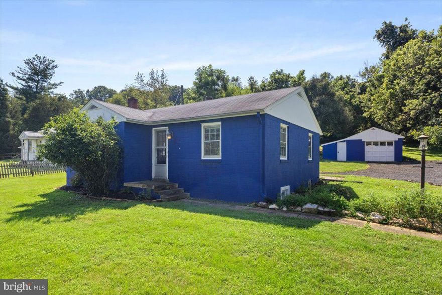 Nestled in a peaceful country setting, this inviting home offers the perfect blend of rural charm and everyday convenience. Surrounded by mature landscaping and located just off a paved road for easy year-round access, the property is only minutes away from a local winery and distillery, ideal for weekend outings or entertaining guests. Moreover, the home is just minutes from the MARC Train, offering easy commuting to the city and beyond.

Step inside to discover an open-concept main level highlighted by beautiful rustic hardwood floors and an abundance of natural light. The kitchen features a warm, open country feel with unique hammered copper countertops that add character and style. The sunroom/breakfast area is a standout space. Bathed in natural light, it’s the perfect spot to start your day, unwind with a book, or simply enjoy the changing seasons. Storage is no issue here, with plenty of closets throughout and an easily accessible attic that provides ample room for all your seasonal and extra items.

The partially finished basement expands the living space and includes a spacious bathroom complete with a soaking tub, separate walk-in shower, and dual sinks. A large flexible room downstairs can be used as an additional bedroom, recreation room, or home office.

This property includes a generously sized garage perfect for storage, hobbies, or working year-round. complete with a cozy woodstove to keep the space warm in all seasons. Whether you're a car enthusiast, craftsman, or just need extra space, this garage offers both functionality and comfort.

This home offers a rare opportunity to enjoy a laid-back, country lifestyle without sacrificing modern comforts.