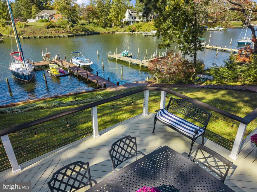 Burley Creek, with its direct passage to Whitehall Bay and the Chesapeake Bay, sets a serene and picturesque stage for this thoughtfully designed waterfront residence, where daily living is effortlessly intertwined with the water.

Countless improvements throughout the years (see improvements list in Documents) has created a beautiful turn-key, low maintenance property perfect for starting your life on the water! The main level unfolds with an open, light-filled floor plan centered around a gourmet kitchen with a spacious island, flowing effortlessly into the dining area. Multiple sliding glass doors line the waterside, opening to an expansive deck that spans the full width of the home, creating a natural extension of the living space and an ideal setting for entertaining or simply enjoying the ever-changing views.

The living room is anchored by a striking double-sided brick fireplace, offering warmth and architectural character while connecting the main gathering spaces. Just off the foyer, a private bedroom with ensuite bath provides a perfect guest retreat. The main level also features a well-appointed primary suite with its own ensuite bath and direct access to the deck, allowing for a quiet, personal connection to the waterfront. An additional bedroom and hall bath complete this level.

The lower level offers a comfortable extension of the home with a family room that opens to a covered patio, inviting easy indoor-outdoor living. A conveniently located powder room and two additional bedrooms sharing a full bath, offer flexibility for guests, recreation, or home office use.

The outdoor experience is equally compelling, with a private pier featuring multiple slips, a floating dock ideal for launching kayaks and paddleboards, and a generous waterside seating area designed for gathering and relaxation. A long driveway leads to an expansive parking pad, providing ample space for guests, while a large storage shed offers abundant room for water toys, lawn equipment, and seasonal essentials.

Located in the Blue-Ribbon Broadneck School district and just 5 miles to downtown Annapolis and Severna Park. Convenient to Baltimore, BWI, Ft. Meade/NSA and Washington, DC., the location provides the very best this region has to offer in a 30-mile radius. Welcome Home!