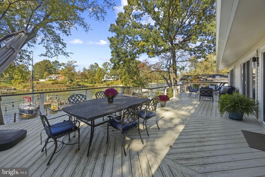 Burley Creek, with its direct passage to Whitehall Bay and the Chesapeake Bay, sets a serene and picturesque stage for this thoughtfully designed waterfront residence, where daily living is effortlessly intertwined with the water.

Countless improvements throughout the years (see improvements list in Documents) has created a beautiful turn-key, low maintenance property perfect for starting your life on the water! The main level unfolds with an open, light-filled floor plan centered around a gourmet kitchen with a spacious island, flowing effortlessly into the dining area. Multiple sliding glass doors line the waterside, opening to an expansive deck that spans the full width of the home, creating a natural extension of the living space and an ideal setting for entertaining or simply enjoying the ever-changing views.

The living room is anchored by a striking double-sided brick fireplace, offering warmth and architectural character while connecting the main gathering spaces. Just off the foyer, a private bedroom with ensuite bath provides a perfect guest retreat. The main level also features a well-appointed primary suite with its own ensuite bath and direct access to the deck, allowing for a quiet, personal connection to the waterfront. An additional bedroom and hall bath complete this level.

The lower level offers a comfortable extension of the home with a family room that opens to a covered patio, inviting easy indoor-outdoor living. A conveniently located powder room and two additional bedrooms sharing a full bath, offer flexibility for guests, recreation, or home office use.

The outdoor experience is equally compelling, with a private pier featuring multiple slips, a floating dock ideal for launching kayaks and paddleboards, and a generous waterside seating area designed for gathering and relaxation. A long driveway leads to an expansive parking pad, providing ample space for guests, while a large storage shed offers abundant room for water toys, lawn equipment, and seasonal essentials.

Located in the Blue-Ribbon Broadneck School district and just 5 miles to downtown Annapolis and Severna Park. Convenient to Baltimore, BWI, Ft. Meade/NSA and Washington, DC., the location provides the very best this region has to offer in a 30-mile radius. Welcome Home!