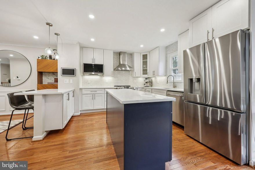 Open House 3/7 and 3/8 1-3pm* Your dream kitchen awaits! Bright and airy, this Tysons townhouse is ready for the next owner. With hardwood floors throughout the main level, custom wood detail in the dining room, and an open floorplan thanks to a kitchen remodel really brightens the space and makes it feel like home. The kitchen features LG Stainless Steel appliances to include an induction range, advanced fridge with 4 different types of ice, island beverage center with separate wine and cold drink compartments, microwave, steam enabled dishwasher, range hood, Silestone Quartz counters, subway tile backsplash and recessed lighting. To complete the kitchen is an eat-in space and sliding glass door to the deck. The main level also includes a renovated powder room and coat closet. <p>

The upper level is carpeted for comfort and features a large vaulted primary bedroom with a huge walk-in closet, bonus linen closet, and en-suite bathroom with two sinks and walk in shower. The two secondary bedrooms each share a hall bath with tub. <p>

The walk out lower level features a gas fireplace, half bath, laundry area, access to the garage, and the fenced backyard with patio. <p>

You can’t beat this amazing location in heart of Tysons Corner with nearby Dunn Loring metro or Tysons metro, Mosaic District, Tysons Corner Center, and downtown Vienna. Just 6 doors down is a playground. The basketball court is located on the other side of Pieris Ct. Enjoy the Vienna life with annual events like ViVa Vienna, Chillin on Church, Oktoberfest, The Halloween Parade, and Saturday Farmers Markets. <p>

Monthly HOA fee is $127 and includes common grounds maintenance, tot lot, snow, trash, and a basketball court. HVAC replaced in 2020.