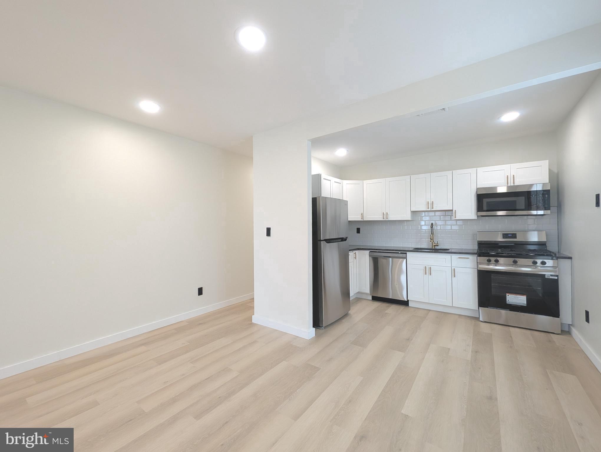 Newly renovated and spacious corner duplex in the fast-growing Port Richmond area! Perfect for an appreciating investment vehicle or house hack with one unit paying off the majority of your mortgage, each unit features luxury finishes & 2 bedrooms each. As you enter the first unit, you’ll be greeted be an extra-large living space, new kitchen with SS appliances, granite countertops, and modern fixtures. The bathroom was completely redone with brand new tiles, vanity, and mirror. W&D hookup in hallway for easy access. The back bedroom features a bonus FULL bathroom and private access to the backyard. Both units also have brand new vinyl flooring, fresh paint, and new HVAC systems. Additionally, the sellers decided to keep the original wood work trim the prior sellers made by hand (owner was a wood worker) vs. the current cheap mdf trims you’ll find in stores. Entering from the side, you’ll find unit 2 with a large open vestibule with private W&D hookup. As you enter the 2nd floor unit, you’ll find a second large living space, tons of windows for natural lights, a similar beautiful kitchen as below. To the rear you’ll find two bedrooms each with their own closet space. This is a prime location just 3 minutes from I-95 & 8 minutes to Fishtown. Market rents can go up to $1650+ per unit. Sellers have decided to keep the units empty post renovation so the new buyers can choose to fill with clients of their choice. Utilities are separated for both units.