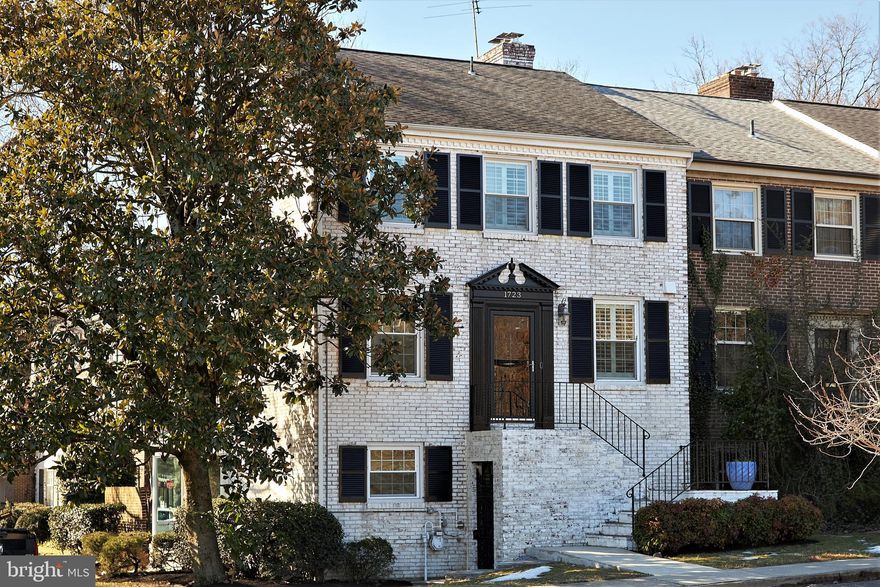 Contracts, if any, need to be in hand by 10:00 am on Wednesday, March 10.   This striking 3-bedroom plus den end townhome with its above grade lower level game room and solarium presides over an 8000+ sqft corner lot distinguished by a magnificent magnolia tree, and brick-enclosed patio with planting beds.  You'll find sparkling updates, 3-sides of windows, 2 fireplaces and large rooms plus a huge kitchen with cork flooring and gas cooking, 3.5 lovely baths -- all in move-in perfection.  Sellers have replaced roof (2008) as well as all appliances, HVAC and windows.   The townhomes of Olde Belhaven Towne are part of a civic association and not a Homeowners' Association  with only a $575/year civic association membership which covers landscaping, snow removal and lighting.    There are 4-5 deeded parking spaces in front and slightly around the front of the home — see the plat online and on the brochure.  In fact, owners of 1723 can enclose the whole side yard, if they want, or paint the house with polka dots (who would?)