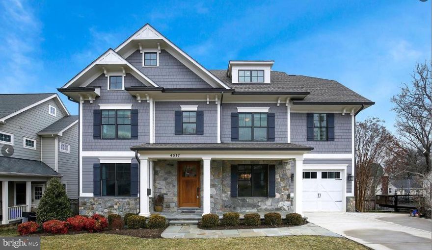 This exceptional Arts & Crafts residence, crafted by the renowned Douglas Construction, offers four beautifully finished levels of thoughtfully designed living space, blending timeless architecture with elevated modern comfort. Generous room sizes, intentional sightlines, and meticulous detailing define every level of the home. Upon entry, the foyer sets the tone, flanked by a private study ideal for working from home and a refined dining space perfectly suited for both formal entertaining and intimate dinners. The main living area unfolds into a warm and inviting family room, featuring custom built-ins and a striking stone-accented gas fireplace, an ideal gathering space for everyday living and special occasions alike.
The adjacent kitchen is a true showpiece, designed for both function and style. Highlights include a n eat-in marble island, Wolf range with pot filler, Sub-Zero refrigeration, and beautifully tailored cabinetry. A discreetly located mudroom enhances daily convenience with custom cubbies, bench seating, a walk-in pantry and separate walk in coat closet. The primary suite offers a serene escape with coffered ceilings, a spacious walk-in closet and a spa-caliber bath.  Four additional spacious en-suite bedrooms and  dedicated laundry room completes the level. The uppermost level provides exceptional flexibility with a large bedroom, full bath, and an open loft space ideal for a fitness studio, creative workspace, or secondary office. The fully finished lower level extends the home’s versatility, featuring an additional bedroom and full bath, an expansive recreation room, and a separate space well-suited for a media room or playroom.
Outdoor living is equally impressive, with a rear deck that leads to a flagstone patio surround by a fully fenced backyard, perfect for both entertaining and quiet relaxation. Distinctive in every way, this home stands apart, offering purposeful design, premium finishes, and refined craftsmanship throughout. Tucked into a charming, park-adjacent neighborhood with nearby trails, the location offers seamless access to Metro, major commuting routes, and the vibrant dining, shopping, and cultural scene of downtown Bethesda—all just moments away.