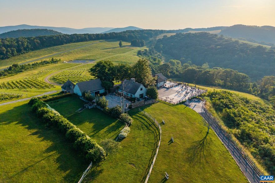 12 Ridges is a breathtaking 268-acre mountaintop retreat along the Blue Ridge Parkway, offering unmatched seclusion with sweeping 360-degree mountain views. Positioned at 3,300 feet elevation, this exceptional property combines natural beauty with the potential of a thriving vineyard, where expert vintners harness the land?s unique qualities to craft expressive wines. With its vineyards at high elevations, Virginia is rapidly emerging as a premier wine region, surpassing more traditionally renowned areas. The property also features a serene pond, a private tennis court, and beautifully remodeled spaces, including the main home and tasting room. Located near Charlottesville, Staunton, and Lexington, 12 Ridges is an extraordinary opportunity for those seeking a private mountain estate with a touch of vineyard charm.,Formica Counter,White Cabinets