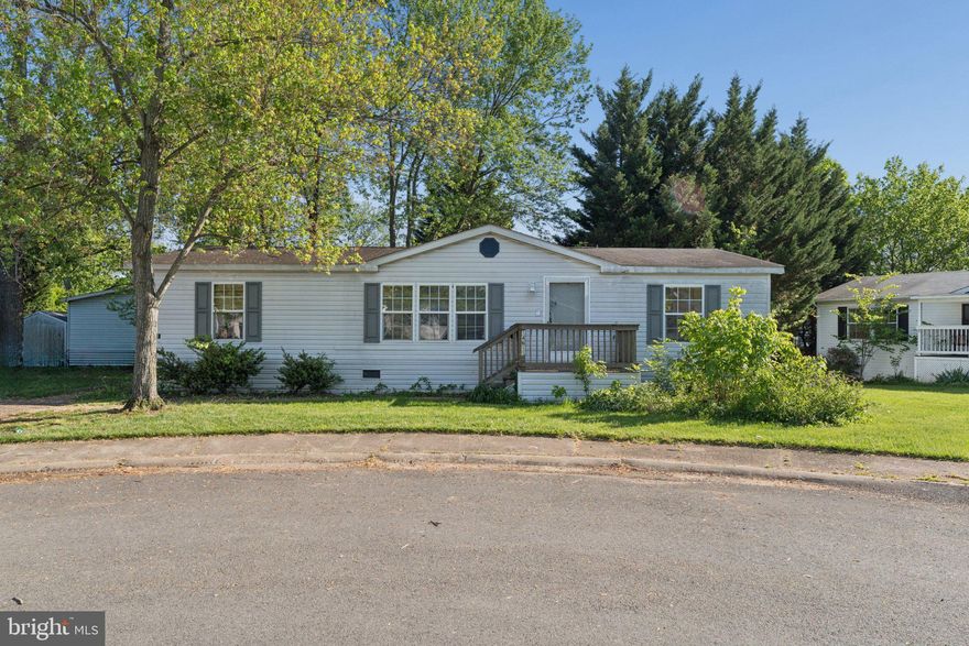 This is a manufactured home in a managed park. All buyers must be approved by Meadows of Chantilly. The current Land Rent is $1878/month. Buyers can pay cash or secure private financing to pay for the house. This is an opportunity to make this home your own with a bit of sweat equity.  Double-wide Commadore model with vinyl siding,  sited on a wide cul-de-sac lot.  The double wide driveway has room for 4 cars.  Open floor plan with vaulted ceilings.  Primary suite with full bath, relaxing tub and lots of closet space.  Two additional bedrooms and a second full bath offer flexibility.  Kitchen with white appliances and a peninsula with counter seating.  Laundry room with full size washer and dryer and access to the rear yard .
Community clubhouse, pool, workout room, tot lot and basketball court. Ideal commuter location near Routes 50, 28, the Dulles Toll Road, and I-66. Walk to shopping and restaurants.