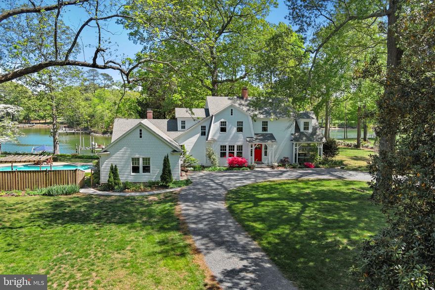 LOCATION and CHARM! Set on 2.32 glorious acres overlooking Dixon Creek, this beautifully and lovingly maintained 1915 residence offers timeless character, refined comfort, and exceptional waterfront living. Original hardwood floors run throughout much of the home, while expansive windows bathe the traditional floor plan in natural light and frame expansive water views from nearly every room. The main level features gracious formal living and dining rooms, a gourmet kitchen with a beautiful center island and top-tier stainless appliances, and a welcoming family room with wood-burning fireplace. Custom built-ins are thoughtfully integrated throughout the home, reflecting quality craftsmanship and attention to detail. Upstairs, the waterside primary suite offers a fireplace, dual walk-in closets and a luxurious ensuite bath with soaking tub and glass-enclosed shower. Two additional guest bedrooms include one with an ensuite bath and another with access to the hall bath. The third level provides a small loft style BR /flexible bonus room, ideal for an office or studio. Outdoor living is equally inviting, with a waterside screened porch, a poolside screened patio with wet bar, and an additional open deck off the dining room—perfect for enjoying the tranquil setting. The beautifully landscaped grounds feature mature trees, lush plantings, and extensive hardscaping, anchored by a stunning gunite pool with expansive deck and surrounding gardens. Additional structures include a charming former icehouse (currently used as a storage shed) and a larger outbuilding once used as tenant quarters. An attached 2-car garage and a full encapsulated basement offer excellent functionality and versatility. With 280 feet of natural shoreline, a private pier with two slips, boat lift, and 3.5–4' MLW, this property captures the essence of Eastern Shore waterfront living. 
*Septic replaced in 2020 and is for 4 bedrooms-owners have plans for proposed first floor primary suite where existing south side porch currently is.