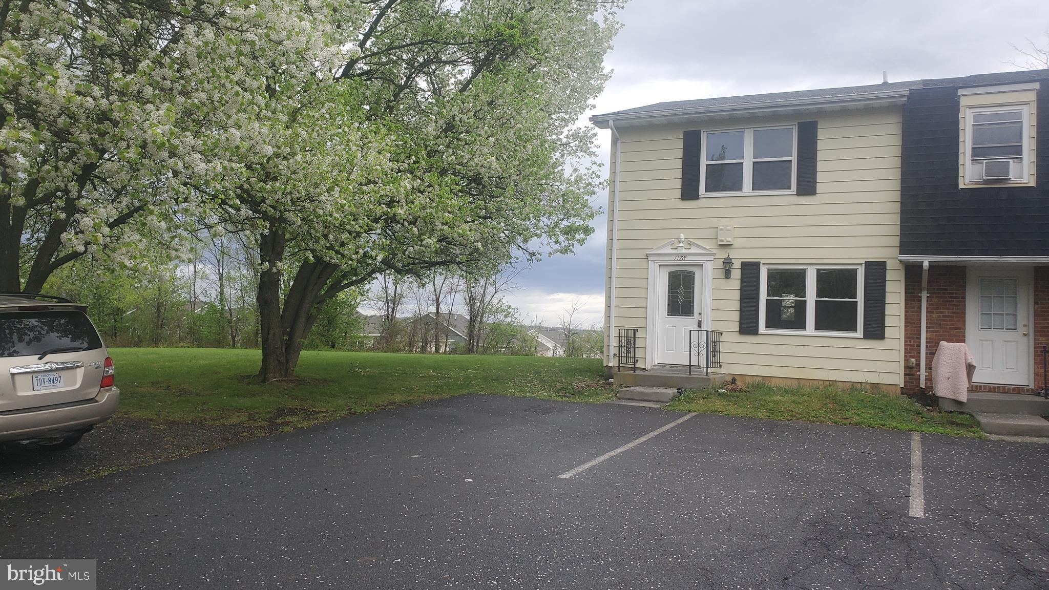 This townhouse has had several high quality upgrades. Cabinets are beautiful, interior doors are a nice upgrade, exterior doors ar a really nice upgrade, ceramic tile in the kitchen, new waterproof laminate going in, interior walls and ceilings fresh tan painted, young heat pump, nice rear deck, fenced back yard, new roof going on, some pressure washing done for that spic and span condition. No maintence should be expected here for a long time. There is a huge mowing maintained field next to this townhouse which allows 3 extra parking spaces to this townhouse's 2 already, until the field is built on, which hasn't happened in hundreds of years. Seems to be a really nice quiet area down on this end. Hurry to see the several huge Bradford Pear trees blossoms next to driveway and house. Owner is a nice realtor.