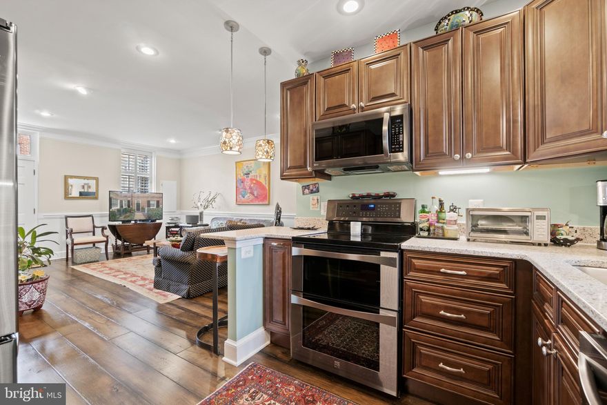 Live in the heart of Downtown Fredericksburg in this 1736 sqft beautiful brick historic building with a Rappahannock River view and designated off-street and visitor parking! This 4 bedroom, 3.5 bath 3 story townhouse was completely renovated in 2019. ***The owner is also installing a brand new HVAC system and thermostat on April 21st. The front courtyard has an English garden feel, a perfect place for your morning coffee. Enter the home through an oversized front door onto its gorgeous, newly-installed hardwood floors that lead you to an open floor plan. Cook your favorite meal in this stunning gourmet kitchen with all darker stainless steel appliances, quartz countertops, exquisite solid wood cabinets, walk-in pantry, and large French door refrigerator. This living room / dining room combo leads you out to the back courtyard where you can BBQ, and entertain your family and friends. Pass the convenient half-bath on the first floor, and walk up the carpeted stairs to the 2nd level Primary suite. This bedroom has hardwood floors, walk-in closet and ensuite bath with renovated tile floors and shower walls, marble countertops, updated cabinets and fixtures.  2nd bedroom has an updated full bath attached as well. 3rd floor bedroom has attached updated full bath next to 4th bedroom that can also be used as an office. This townhome has everything you can ask for, even has a cellar with a hatch-door in the dining room floor. Stroll down to the Rappahannock Trail, or walk to restaurant row, shopping, and parks. Live in a historic craftmanship building with the comforts of a renovated modern home!