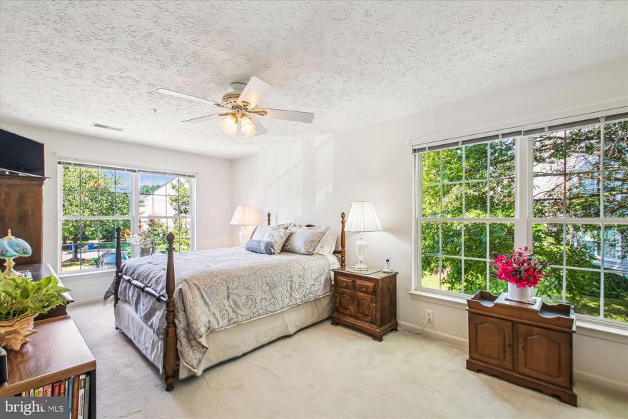 Welcome Home! This well maintained second-level, end-unit condo in the sought-after Windgate Condominium Community is bathed in natural light. Boasting an open concept floor plan, this inviting 2 bedroom, 2 full bath home, is ready to start its next chapter. 
As you near the front door, you will see the happy plants the seller has welcoming you to their door. Once inside, you will love all of the natural light. The living area showcases a gas fireplace,, ample space for furnishings and a beautiful balcony. This condo offers tons of great storage space too and both the primary and secondary bedrooms have an attached full bathroom, making it an ideal layout for all. Great for roommates, hosting guests are just kicking back at home.  
This community is conveniently located just minutes from Historic Downtown Annapolis, the Annapolis Mall, Routes 50 and 97 and so much more. Book your showing today!