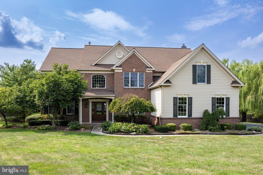 Welcome to your dream home in Skippack Township, just steps away from Palmer Park and the Perkiomen trail that leads you into the town of Skippack! This exquisite 4,198 square foot residence sits on an acre of land, offering a large backyard with an in-ground saltwater pool, creating a private retreat.

As you enter through the two-story foyer, you'll be greeted by hardwood floors that extend throughout the home. To the right, there's an office with built-in cabinets and a charming barn door, complete with automated blinds for convenience. To the left, you'll find a spacious living room and dining room.

The great room features a two-story ceiling, gas fireplace, a wall of windows, and a back staircase, seamlessly flowing into the open kitchen. The kitchen is a chef's delight with a gas cooktop, double ovens, a large island, stainless steel appliances, and automated blinds. The kitchen is brightened by a skylight over the sink, and large floor to ceiling double door sliders open to a deck that overlooks the pool and your private backyard retreat. Completing the main level is a powder room and a three-side entrance garage leading to the mudroom and laundry room.

The finished basement is perfect for entertaining, boasting a wet bar with a concrete top, a refrigerator, kegerator with built in tap, dishwasher, beverage refrigerators, cinema lighting, a gas fireplace, dehumidifier, and plenty of space for gatherings. There's also a workout area, 2 storage closets, a half bath, and steps leading to the backyard.
On the second level, you'll find four spacious bedrooms and two full baths. The primary suite is a luxurious escape, featuring a tray ceiling, a sitting area, a large walk-in closet, and a sizable bathroom with a soaking tub, a stall shower, and double sinks.

This stunning home combines modern amenities with elegant design, making it the perfect place for relaxation and entertaining.