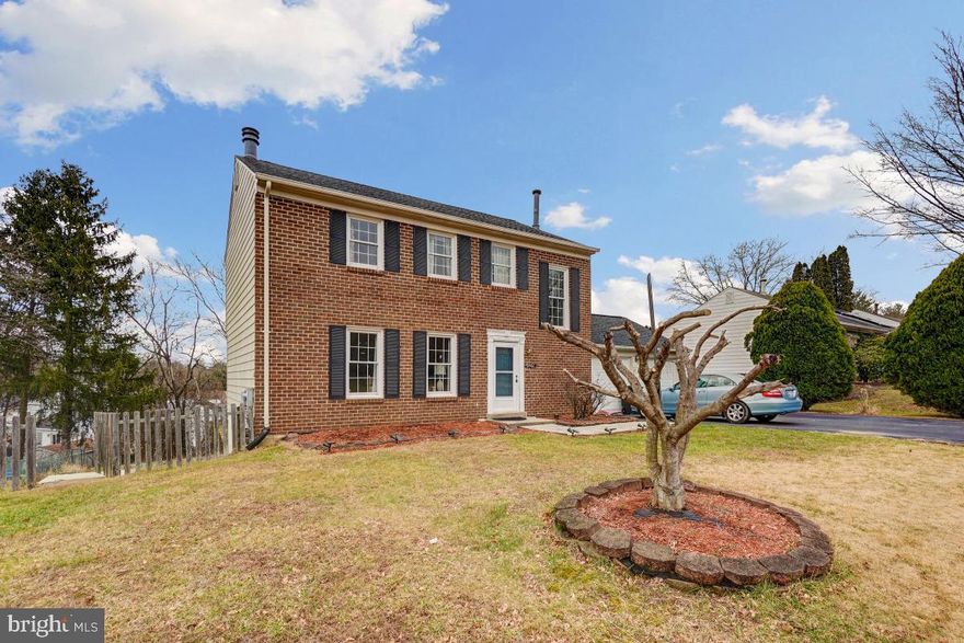 Welcome to this beautiful brick front colonial home situated on a 1/4-acre lot with NO HOA! New floors on main level just installed! (Pictures were taken prior to floor installation). New roof and gutters in 2020. New Microwave and Washer in 2022. New Refrigerator, Dishwasher, Garbage disposal and Stove/range and hood in 2021. All new Kitchen cabinets in 2021 and gorgeous new Quartz countertops in kitchen in 2021! There is a deck off the kitchen, which needs a little TLC but would be perfect for entertaining! The lower level is finished with a cozy wood burning fireplace and walk out to the large back yard.  The upper level has four bedrooms and two full bathrooms! Schedule your showing today!
