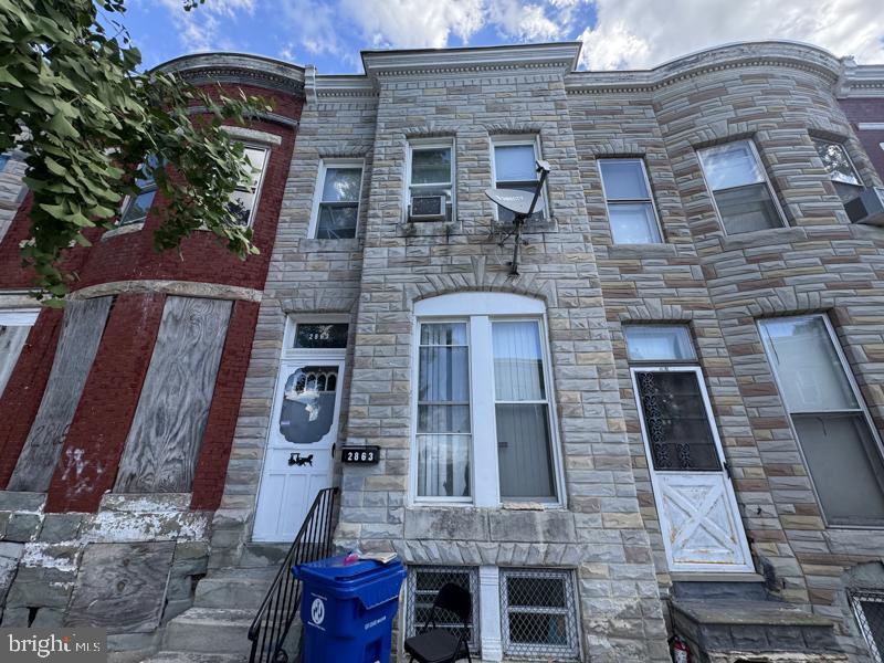 Spacious three bedroom all brick townhome in convenient location. Open main level floor plan with hardwood flooring. The home features a huge covered back porch. Plenty of street parking and great access via the rear alley. Unfinished basement is ready for imagination.