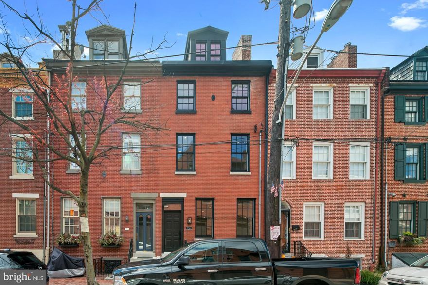 Welcome to 120 Queen St., a meticulously renovated historic 4 bed, 3.5 bath home on one of the most desirable streets in the heart of Queen Village. With extensive renovations from top to bottom, 120 Queen St. is essentially a brand new home. Equal parts practical and stylish, the marble-tiled entryway sets the stage for the impeccable, top of the line finishes throughout the home. The open-concept first floor features white oak floors that continue through the rest of the home, 10-foot ceilings, 18 feet of width, a working gas fireplace with elegant granite mantle, a convenient powder room, and the stunning designer kitchen. Features of the show-stopping kitchen include marble counters with custom Carrera backsplash, matte black hardware, a pot-filler, and Bertazzoni appliances. Out back, you'll find a one-of-a-kind rear yard with hardie plank exterior, brick patio area, LED lighting under the cement and artificial turf. Back inside, floating stairs with 3.5" thick white oak treads lead to the full second floor master suite with sitting room. Highlights of the master suite include a walk-in California closet and a gorgeous marble bathroom featuring a dual vanity, Duravit toilets and tubs, and state of the art Moen U Shower system. On the third floor, you'll find a spacious bedroom, a bonus office space/sitting area/play room, and access to the third-floor outdoor space. An attic bedroom and full bath top off the fourth floor. This home's fully finished, expansive basement offers a custom full bar with two wine coolers, a working bar sink, and built-in speakers perfect for hosting parties and holidays as well as ample space suitable for more living space, a playroom or a movie room. Additional features of this home include an Innovative Security System with Full Home Automation, full 10 year Tax Abatement, Meredith School Catchment, two zone energy efficient HVAC systems, Duravit toilets and tubs, California Closet sytems in all bedrooms, speakers wired throughout the house, and one year of pre-paid parking at a nearby lot. The unbeatable Queen Village location of this home is walking distance to incredible restaurants like Hungry Pigeon, Royal Sushi & Izakaya, Dmitri's, Cry Baby Pasta, and easy access to 95!