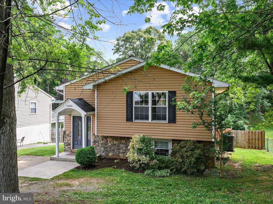 Welcome to this super 3500+ sq. ft. home in the water-privileged Cape St. Claire. Enlarged and redesigned in 2008 for optimal flow, this residence sits on a generous .33-acre lot and offers the perfect blend of refinement and comfort. 
Step inside to discover a beautifully designed gourmet kitchen with adjacent dining and family rooms, perfect for entertaining and family gatherings. Or choose the quiet of the upper level living room to curl up with a good book. The primary suite is a true retreat, featuring a private balcony where you can enjoy your morning coffee or unwind after a long day. Bathrooms adjoin each of the spacious upper bedrooms. Work from home in comfort in the fifth bedroom/office with access to the rear deck. Worth noting are the plumbing rough-in in the large pantry should one prefer a lower level laundry room and the exterior electrical hookup for a trailer/camper. 
With spacious living areas, modern amenities, and elegant finishes throughout, this home is a rare find. Enjoy the best of coastal living with community water access, beaches, and all the charm of Cape St. Claire. Don't miss your chance to make this exquisite property your own!