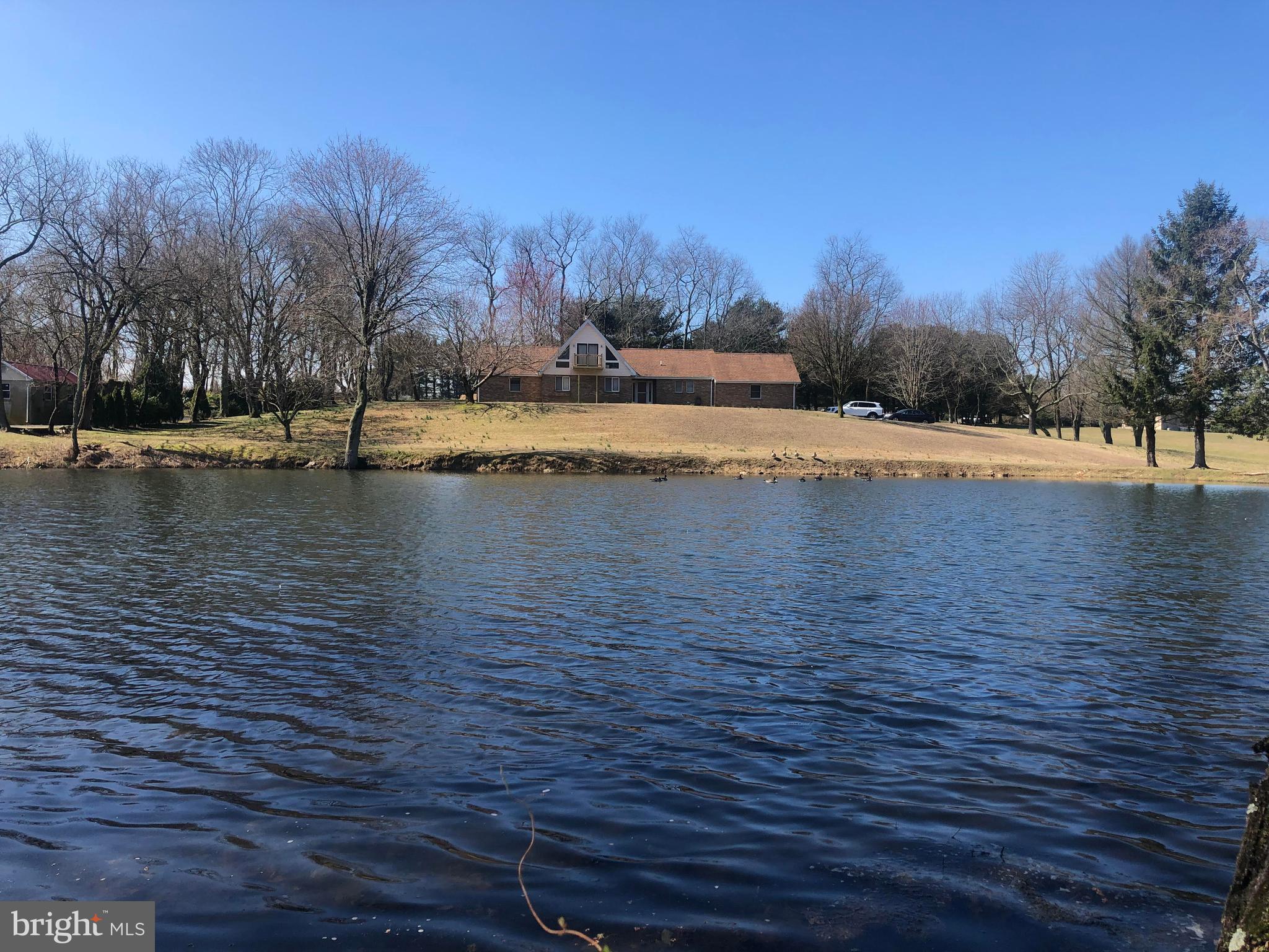 Privacy!! All brick Rancher home on 7.23 acres with beautiful pond. Vaulted wood beam ceilings in Family Room with sky lights give a cozy feel. Large Master Bedroom with walk in closet and bathroom. Large 2 car side entry attached garage . 3 beds/ 2 baths with a bonus room upstairs. NO HOA Bring your toys, and horses! Call for a private showing today or a live virtual interaction tour while asking questions from the privacy of your own home!!