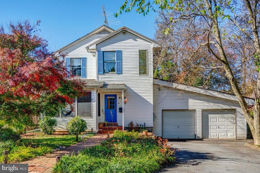 Offers, if any, due Tuesday 3/7 by 3pm!This well-maintained and expanded home is situated on a quiet, tree-lined street in the desirable Crestview neighborhood, featuring four bedrooms and four and a half bathrooms, including a licensed accessory apartment. The professionally landscaped exterior compliments the sun-filled interior, highlighting hardwood floors throughout and a spacious floor plan, perfect for everyday living and entertaining. The main level features a formal dining room, living room with a built-in bar, sun-filled family room, and a large eat-in kitchen with stainless steel appliances, ample cabinetry, an oversized walk-in pantry and access to the back deck. This level also offers two bedrooms, including the primary suite with ample closet storage and an ensuite bath with a walk-in shower, double jetted soaking tub and double vanity. The second main-level bedroom can be used as an office/den and features a lofted area. Completing this level is a powder room and access to the oversized two-car garage that features a third spot currently serving as a workshop, but potential to be finished into an additional bedroom or au-pair suite. The front stairs off the entry lead to the licensed second-floor accessory apartment that has an additional full eat-in kitchen, bedroom, full bathroom, and den (which is the perfect home office). The unit can be rented out and can be completely locked off from the rest of the home. The back part of the second level has an additional staircase from the main level and offers another bedroom and updated bathroom, as well as a beautiful landing surrounded by built-in bookcases and open to the lower level. Rounding out this home is the walk-out lower level that includes a recreation room, an additional full bathroom, a potential bedroom, laundry and ample storage. The professionally landscaped exterior serves as an extension of the home, offering a back deck and a fenced-in flat yard with mature trees, plantings and garden beds. Located in Crestview, this home is located within close proximity to the Capital Crescent Trail, major commuter routes, and the restaurants and shops in Spring Valley, Westbard, and Friendship Heights.