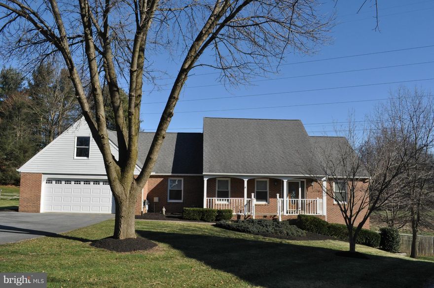 Whether you're enjoying the views from the bay window or screened porch, entertaining in the vast lower level, or splashing in the pool, you'll love the life in this updated home. Custom kitchen (2015) is a cook's dream. The first-floor master suite has a gorgeous bath (2015), dressing area, and 3 closets. 2 gas fps. Options for office, studio, hobbies, more. Convenient location near high school.