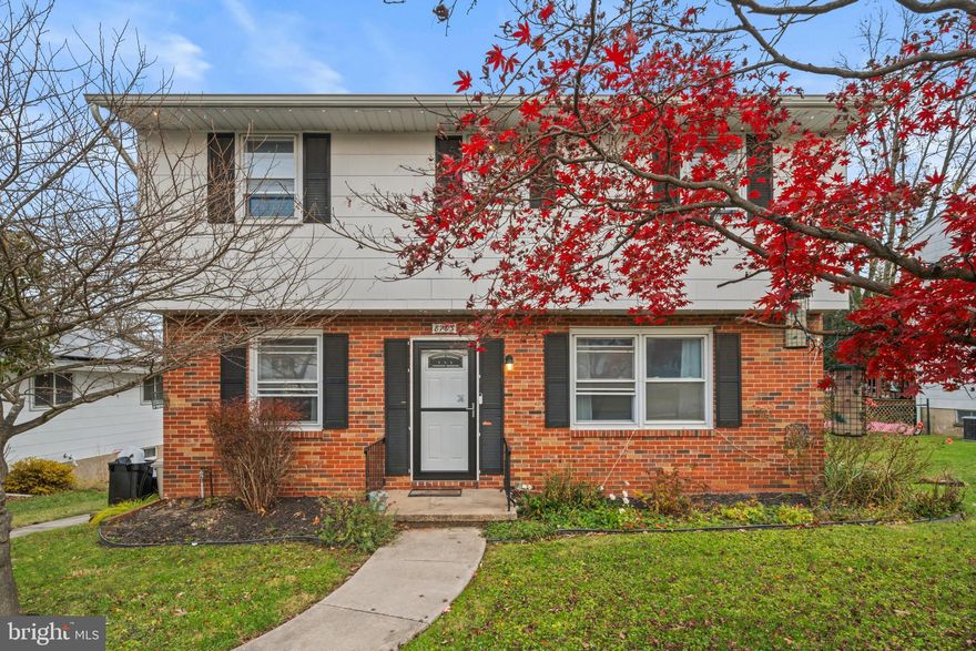 WELCOME HOME to this fantastic 5-bedroom, 3-bath colonial in Parkville. Boasting an excellent floor plan, prime location, and extensive renovations, this home offers exceptional value and won’t disappoint. Nearly everything was updated in recent years, throughout—windows, furnace, central air, kitchen, bathrooms, lighting, doors, carpet, paint, and more. The main level showcases generous rooms with hardwood floors and abundant natural light. The expansive living room, dining room, and kitchen flow seamlessly in an open layout. A private main-level flex space can serve as a 5th bedroom, den, or office, with an adjacent fully renovated full bath. The open kitchen includes white cabinetry, granite countertops, stainless steel appliances, a large window over the sink overlooking the backyard, and a door leading to the spacious patio/balcony. Upstairs, four spacious bedrooms feature full-height ceilings, two fully updated bathrooms, and large closets with organizers. The lower level offers a bar, ample space for a fun and entertaining,, and a comfortable relaxation area. The fenced rear yard includes a large firepit perfect for relaxing. The driveway accommodates two cars, with additional on-street parking available.