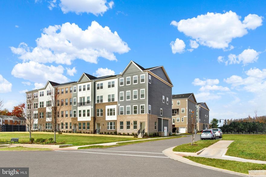Model homes now available to tour. This modern two-level townhome-style living, complete with a one-car garage, is perfectly designed for contemporary living. The main living area features a spacious, open-concept floor plan that includes a stunning kitchen with sleek Ice White quartz countertops and Linen white cabinets. Off of the Great Room, there is a large covered balcony, and a finished flex space, perfect for use as an office or exercise room. On the second level, you'll find three bedrooms, including a generously sized owner’s suite that boasts a spa-inspired bathroom and a walk-in closet. A laundry room equipped with a full-size washer and dryer is also conveniently located on this floor.

Ashberry is an exciting community offering new townhome-style living now selling in Manassas, VA. Homeowners will be a short walk from all that Old Town has to offer – including fine and casual dining, unique shops, entertainment and vibrant nightlife, as well as the Virginia Railway Express (VRE) station providing simple access to business hubs in the Metro DC area. Ashberry is just minutes from VA-28 and VA-234.

Please call and schedule an appointment with the sales team and visit the showroom located at  9661 Swallowtail Ln, Manassas, VA 20110.

Prices, dimensions and features may vary and are subject to change. Photos are for illustrative purposes only.