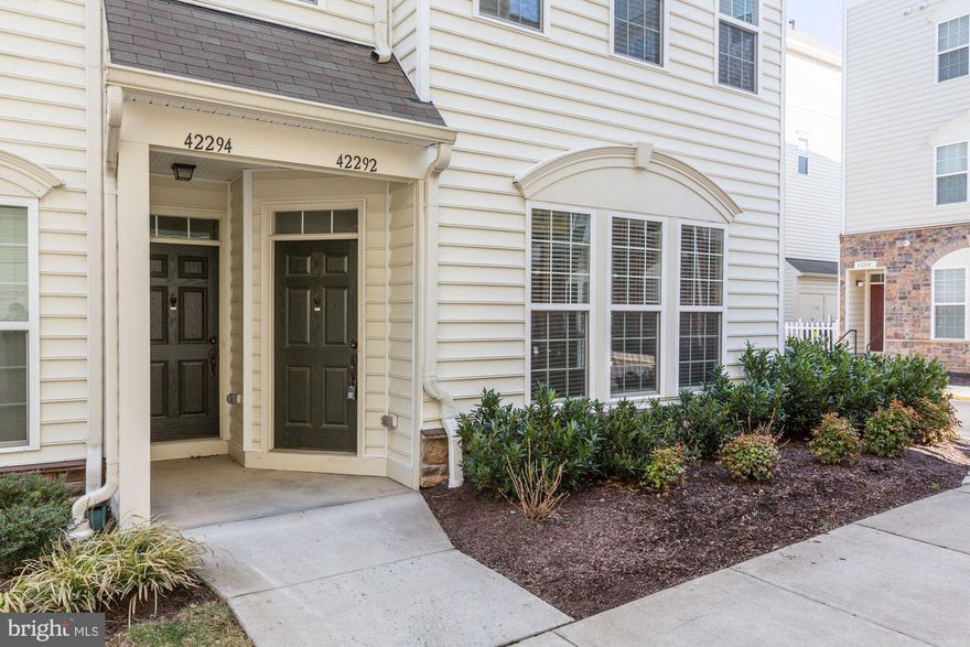 Spotless, like new 2 level condo with garage is only 5 years young.  This Van Metre Chelsea model comprises the bottom two levels of this amazing condo.  Freshly painted.  3 Bedrooms 2 1/2 Bathrooms.  Main level features hardwood floors, living & dining rooms with fully updated kitchen & powder room.  Kitchen with granite counters, stainless steel appliances, beautiful cabinets & a breakfast bar.  Upper level features a family room with SGD to balcony as well as 3 nicely sized bedrooms along with 2 full bathrooms.  Upper level laundry.  Community is amenity rich with pools, tennis courts, tot lots, fitness center, club house & jogging/walking trails.  Convenient location close to Stone Ridge Village Center with Harris Teeter, Glory Days Grill, and much more.  Easy access routes to Route 50,  Dulles Airport & Dulles Tech Corridor.  Don't miss out!  No pets please!