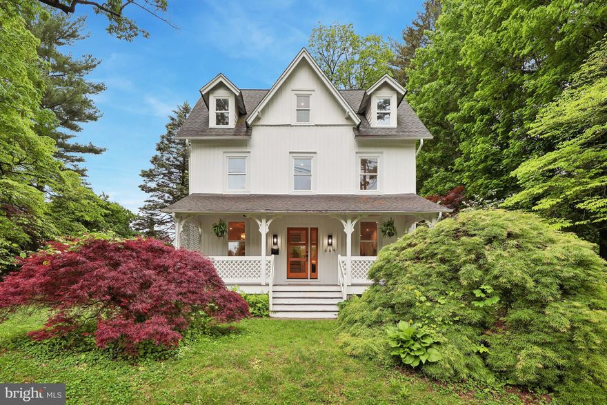 Located in the heart of Radnor Township, this fully renovated modern victorian farmhouse blends timeless charm with contemporary elegance on a spacious half-acre lot. A wide front porch spans the entire width of the home, creating the perfect spot to relax and unwind. Inside, the 5-bedroom, 3.5-bath layout offers a thoughtfully designed open floor plan with durable and stylish LVF flooring, custom shaker cabinetry, and sleek matte black hardware. The chef’s kitchen features quartz countertops, a herringbone marble backsplash, premium stainless steel appliances, and a separate pantry, flowing seamlessly into the dining and living areas. A cozy den, private study, and statement fireplace add warmth and functionality. The second floor boasts a luxurious primary suite with a spa-like bath, double vanity, rainfall shower, and soaking tub, along with an additional bedroom and full bath. The third level offers three more spacious bedrooms, another full bath, and a dedicated laundry room for added convenience. Outdoor living is just as impressive, with a large back patio off the kitchen, a sprawling yard, and an oversized detached two-car garage with loft space—perfect for storage or future expansion. The unfinished waterproof basement provides even more potential. With a prime location in Radnor Township and a thoughtful blend of classic and modern design, this home offers a rare opportunity for refined Main Line living.