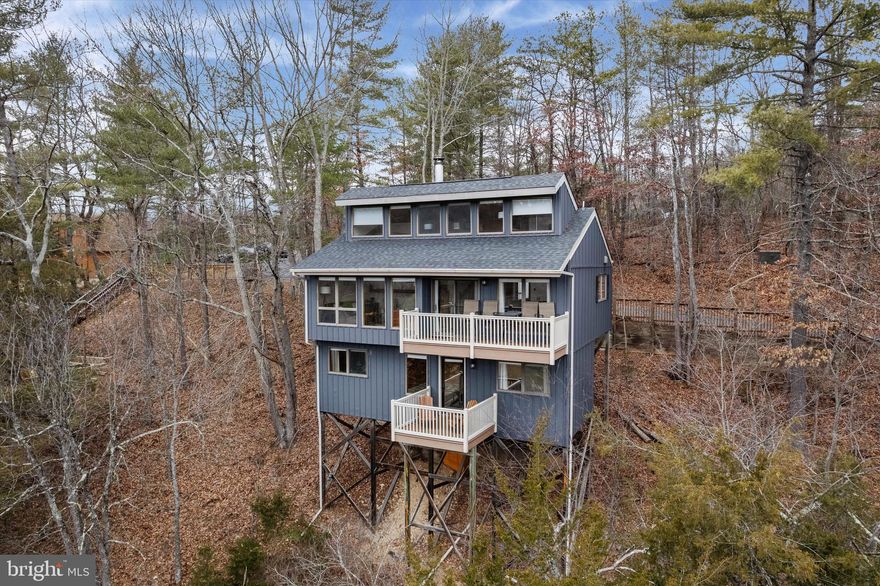 Breathtaking 3-Bedroom Retreat at Bryce Resort – Unmatched Views & Year-Round Adventure!

Welcome to your dream mountain escape! Perfectly perched in the heart of Bryce Resort, this 3-bedroom, 2-bathroom retreat offers stunning panoramic views of the ski slopes, golf course, and even the airstrip—where you can watch planes gracefully land and take off.

Step inside and be captivated by the soaring ceilings, walls of windows, and the warmth of a wood-burning fireplace. The open-concept main level boasts a primary suite with an en-suite bath and laundry, plus a spacious kitchen, dining, and living area that seamlessly flows to one of two slope facing decks —ideal for taking in the breathtaking scenery.

Upstairs, the loft space provides flexibility for a home office, reading nook, or bonus sleeping/living area.

The lower level is designed for relaxation, featuring two additional bedrooms, a full bath, and a unique soaking room with a jetted 2-person Jacuzzi tub, perfectly positioned for unparalleled slope-side views. Then step outside to the lower slope facing deck before turning in for the night.  On the main level there is also an additional deck area, just off of the main entrance, with fire pit, where you can enjoy crisp mountain evenings under the stars.

Fully furnished and move-in ready, this rare mountain retreat with gorgeous views of the true core of Bryce Resort, is the perfect getaway for skiing, mountain biking, golfing, and year-round adventure.

Don’t miss your chance to own one of Bryce Resort’s most spectacular view properties—schedule your private tour today!

*Please be sure to take note of the various updates noted in the documents section - to include a new roof in 2018*