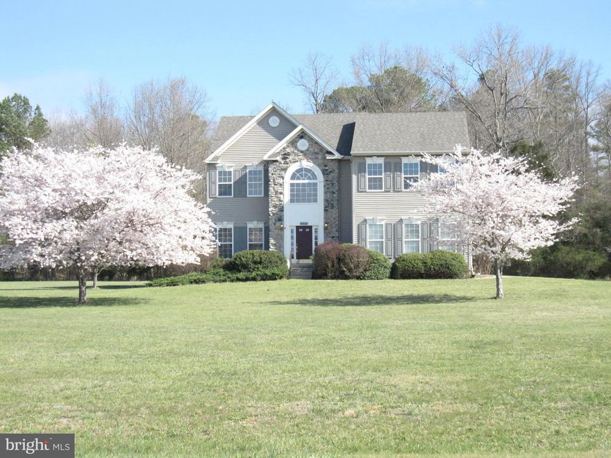 Wonderful home sets on  level, private & spacious  lot.  This beautiful 4 bedroom home backs to trees and has water privileges at the neighborhood pier.  Long paved driveway leads to 2 car side load garage. Beautiful stone entry way. New paint and carpet are throughout. Kitchen has new stainless steel stove, island and pantry. Basement is unfinished w/ rough in. Geothermal heat pump!Beautiful !!