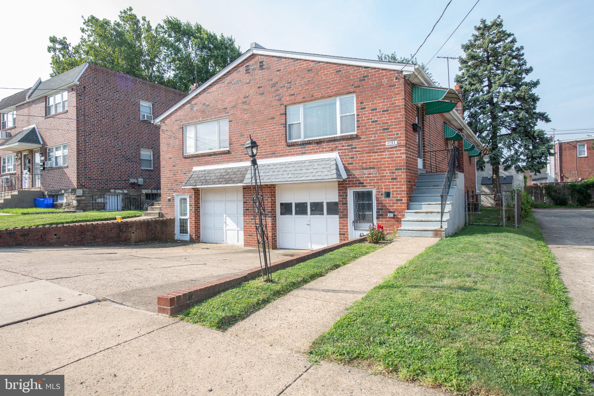 Check out this updated 2 bedroom, 1.5 bath home located on a desirable block in Rhawnhurst. Enter through the main level to find beautiful hardwood flooring throughout, a large front window that lets in plenty of natural light and tastefully painted walls. The kitchen has been upgraded and features refinished cabinetry, updated appliances, and a custom breakfast bar with granite countertop and additional base cabinets for added storage. Down the hall you will find the 2 updated bedrooms along with a remodeled 3 piece main bathroom. The lower level includes a spacious finished area with a sliding door that leads out to the back yard, a separate laundry area with a half bath, and a 1 car attached garage with inside access. Some other features include a newer roof that was installed in Nov 2023, updated plumbing and electric, and a fenced in yard with a large storage shed. This property is conveniently located to restaurants, shopping and public transportation. Don't miss out, schedule your showing today!!