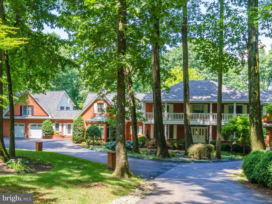 Dramatic Price Adjustment on this private estate, 3.9 acres w/gated circular drive, Huge kitchen/morning room overlooking Spectacular gardens and pool, 2 story family room w/stone stacked fireplace, Wonderful Master suite w/his/her master bathrooms, 6 car garage featuring full apartment with 2 bedrooms and kitchen,Separate pool house w/every amenity. Professionally landscaped grounds w/pond.