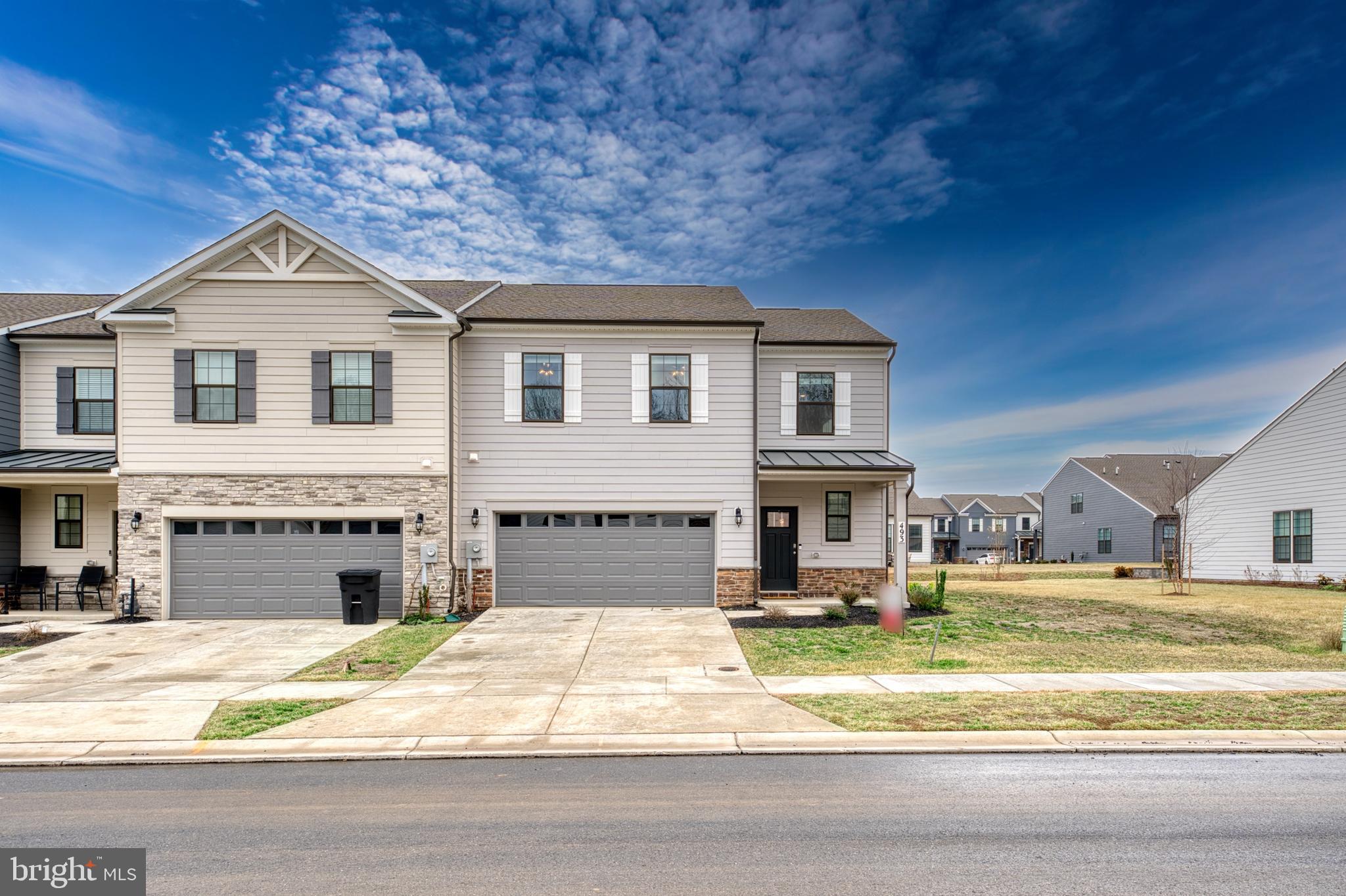 Come See This One Year New , Stunning End Unit Main Level Primary Suite Villa Style Home
in the Renn Quarter Neighborhood, Close to Downtown Frederick!
This "Villa" floor plan is a rarely available model that is currently not being built by DR Horton.
This open floor concept with 2,532 sq ft includes, soaring 9-foot ceilings, wall to wall luxury plank floors, and hardwood stairs. The Gourmet Kitchen includes 42-inch white cabinets, quartz counters, herringbone style backsplash, stainless steel appliances including a gas cooktop, wall oven, microwave, dishwasher and refrigerator with ice maker and a large kitchen island that is perfect for entertaining. This home is equipped with a monitored security system which can be used remotely to control your thermostat settings and much more in your home. Next to the Living Room is the Primary Bedroom, with an attached Primary Bathroom which has glass enclosed stand-in shower, tile flooring throughout, dual vanities with quartz counter tops. The Primary Bathroom leads to an expansive walk-in closet. Upstairs, there are 2 bedrooms and 2 baths with a media room loft space that can also be used as an office area. The second Primary Bedroom upstairs includes a second En-Suite bathroom with a tub/shower combo and walk-in closet. Renn Quarter is a growing community that includes an outdoor pool, fitness center, playgrounds, gazebo, dog park, scenic jog/walk paths, trash and recycling service, yard landscaping, and snow removal. It is also the last residential community that will be considered walkable to Downtown Frederick and is the location of the future Carroll Creek Walkway Extension. This home is close to major commuter Interstates 270/70/15. Don't miss out and make this stunning Villa your home today!