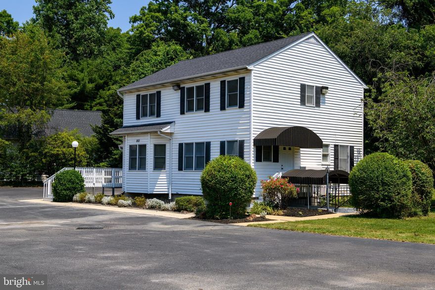 This STANDOUT PROFESSIONAL OFFICE BUILDING with both charm and flexibility is strategically located directly on the fast-paced Annapolis Road/Gambrills Road corridor connecting Odenton with Waugh Chapel, Crofton, Route 3/301 and I-97.  The .81-acre tract with 165 F of road frontage and stalwart signage easily captures the eye while providing ease of entry with bountiful parking. Thoughtfully updated of late  with refinements, this three-level, 3,000+ SF diverse working environment features an Upper Level of totally open, sun-filled windowed space, a bath and storage. The more conventionally subdivided Main Level offers workstations, a cozy conference room, a full kitchen and a conveniently located bath adjacent to a separate, second entry. The Lower Level has an airy openness replete with substantial storage, a kitchen/dining niche, a full bathroom with walk-in shower plus an additional classically-designed awning entry to the lushness of the grounds. The C-1 zoning  designation allows a wide myriad of uses.