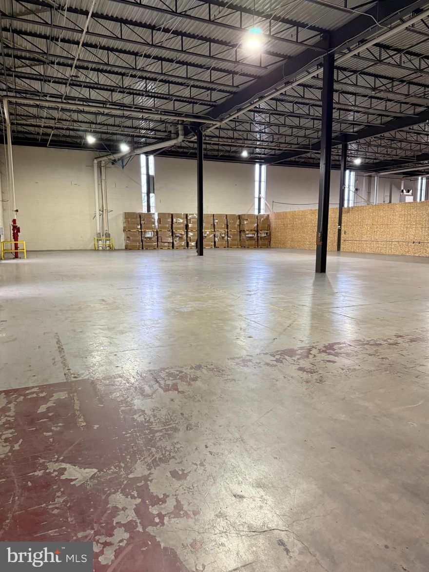 Building 16, Suite D, is a warehouse space featuring a wide-open floor plan with ceiling heights of approximately 16 feet, a private restroom, and office space. Conveniently located adjacent to eight loading docks and just one mile from Route 30. The rentable area totals 10,819 square feet, with 9,664 square feet of usable space. The suite is also equipped with a sprinkler system and 24-hour security.