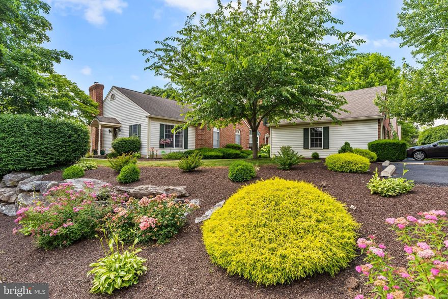 Southpoint of Hershey end-unit townhome,  w/ meticulous landscaping and beautiful setting! This home is graced w/ brazilian cherry hardwood as you enter, endless attention to detail and a finished LL w/ a 3rd bedroom, full bathroom,  office or workout room, along w/ a utility room and plenty of storage. There is also a wet bar, living room w/ gas fireplace (not currently connected to propane tank) and private entrance from the back of the exposed basement, making this a possibility for an in-law suite or the family member who needs to stay somewhere.  The primary bedroom is accessible to the sunroom,  which is perfect for late night reading, or just sitting and enjoying a breeze.  This renovated kitchen is enhanced by a tiled backsplash, granite counters and a pass through opening to the dining room.  The 1st floor living room has cathedral ceilings and a propane gas fireplace.  There is 1st floor laundry right off of the primary bedroom.  Primary bathroom has recently been remodeled w/ dual sinks, granite counters, walk-in shower and plenty of custom cabinetry for storage. There is also a 1-car garage and plenty of parking for guests!