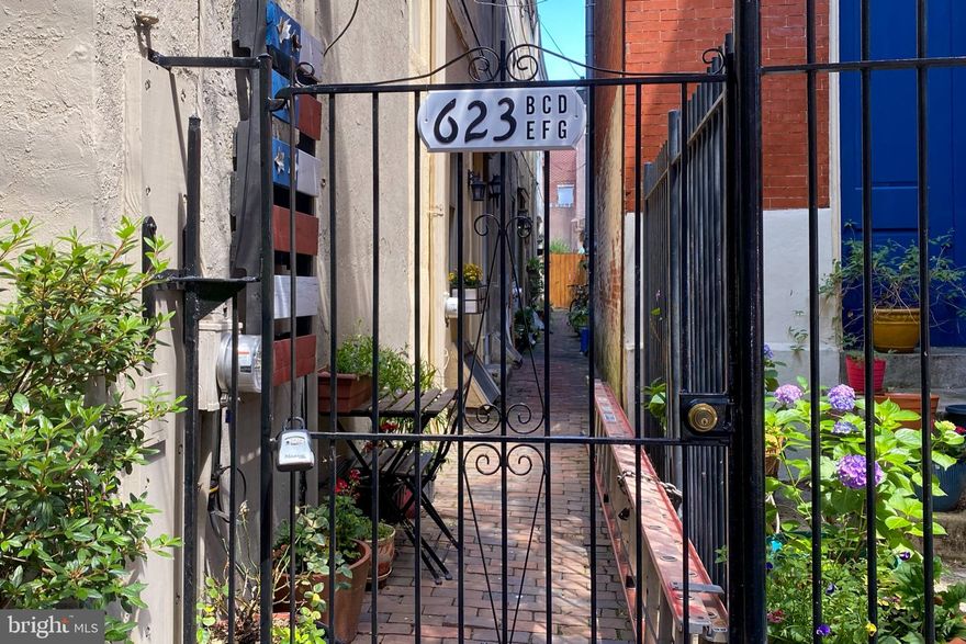 Welcome Home ! This charming Queen Village trinity, circa 1850, is located in the award winning Meredith School Catchment and has 3 stories, 2 bedrooms and it is in the most beautiful and sought after family neighborhood! This handsome abode exudes curb appeal which greets you as you walk down its quaint, tree lined street through the picturesque graced, gated courtyard with wrought iron decorative railings and framed with planter boxes. As you enter this light filled home, please note the classic details like beautiful original wide plank hardwood floors, generous windows, open layout, curved stairwells, and exposed brick. It also offers the comforts of central air conditioning, gas heat, gas cooking, a beautiful eat in kitchen with butcher block counter tops and solid wood cabinets, and closets galore. This location is a moment's walk to historic Headhouse Square with its farmer's market and craft fairs, local restaurants, cafes, coffee houses, bookstores, antique and specialty shops. The seller is offering 1 year prepaid parking at a parking lot 1 block away. This location boasts a walking score of 99 and a bike score of 98! Why rent when you can own? Pictures do not lie, Make your Move!!