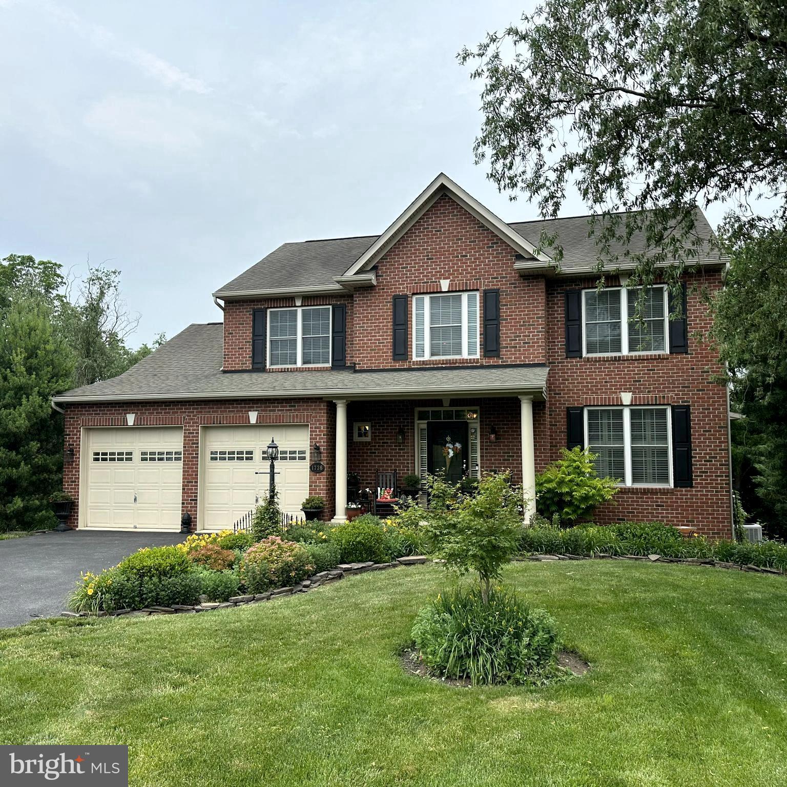This 4-bedroom, 2.5-bath brick-front home has everything you need and feels like your own private retreat. Step inside to a beautifully lit foyer that sets the tone for the rest of the home. To your left is a convenient hallway half bath, while to your right, the formal living and dining rooms sit side by side—perfect for entertaining. The kitchen opens to a bright breakfast area and a cozy family room complete with a gas fireplace, creating a warm and inviting space for everyday living and gathering! From the breakfast nook, step out onto the back deck that overlooks a quiet, tree-filled yard—ideal for morning coffee or evening unwinding. Below the deck, a shaded patio offers another spot to relax, grill, or enjoy the peaceful outdoors. The first-floor laundry and mudroom are conveniently located just off the kitchen and attached two-car garage. A spacious walk-out basement adds even more flexibility, ready to be transformed to suit your needs. Surrounded by mature trees and thoughtful landscaping, the property offers both privacy and tranquility. A backyard shed is included and ready for use. Move-in ready and full of charm this home offers so much!