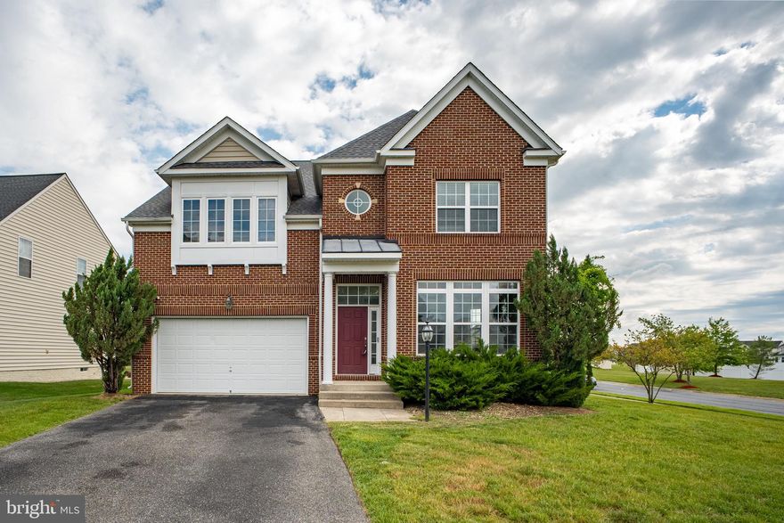 Move-In Ready & Freshly Updated! Welcome to 7108 Sudley Avenue, a stunning 6-bedroom, 4-full-bath colonial in the sought-after Lakeview at Brandywine community. This home has been professionally refreshed with a brand-new custom paint palette across all three levels, offering a crisp, modern aesthetic that is truly "turn-key."

Spanning over 4,300 sq. ft. on a premium 0.34-acre corner lot, the main level features an open-concept design with gleaming hardwood floors, a formal dining room, and an inviting family room with a cozy fireplace. The gourmet kitchen is a chef's delight, complete with a sun-drenched breakfast nook.

Retreat to the upper level's spacious bedrooms, including a luxury primary suite. The fully finished walk-out basement—also freshly painted—provides two  bedrooms and a full bath, perfect for an in-law suite, home office, or guest quarters. Enjoy the high-efficiency benefits of the NEW HVAC system and the convenience of being minutes from Brandywine Crossing and major commuter routes. Sparkling clean and ready for its new owners!